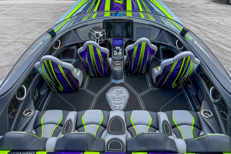  Yacht Photos Pics 2024 MTI 440X boat interior with vibrant green and purple seating, sleek design.