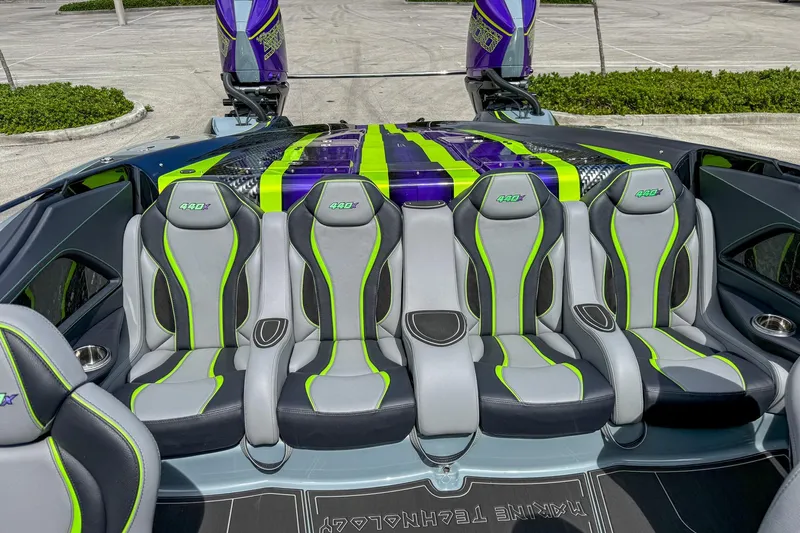  Yacht Photos Pics 2024 MTI 440X boat interior with sleek gray and green seats, vibrant design.