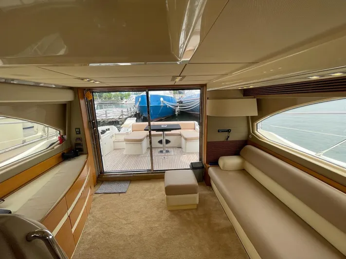 Obsession Yacht Photos Pics Luxurious interior of a 2012 Azimut 53 yacht with elegant seating and outdoor view.