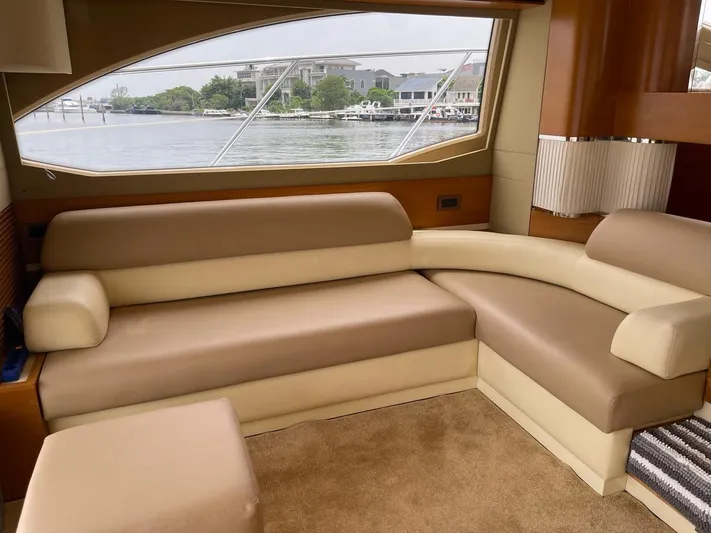 Obsession Yacht Photos Pics Luxurious interior of 2012 Azimut 53 yacht with beige leather seating and waterfront view.