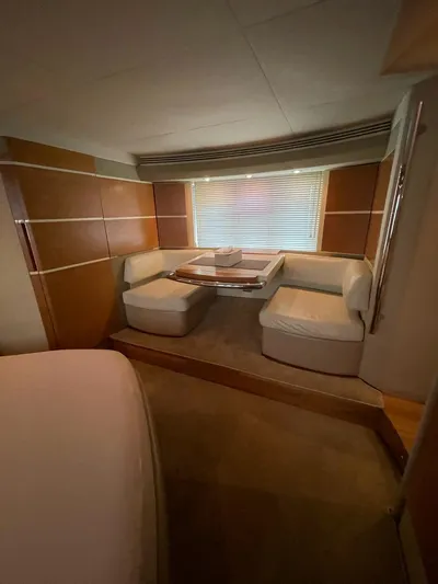 Obsession Yacht Photos Pics Luxurious interior of a 2012 Azimut 53 yacht with elegant seating and table.