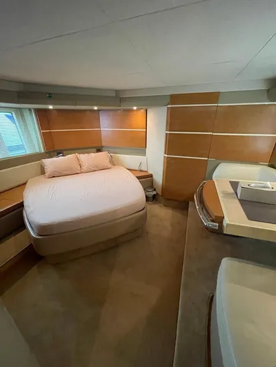Obsession Yacht Photos Pics Luxurious bedroom interior of 2012 Azimut 53 yacht with modern design and cozy ambiance.
