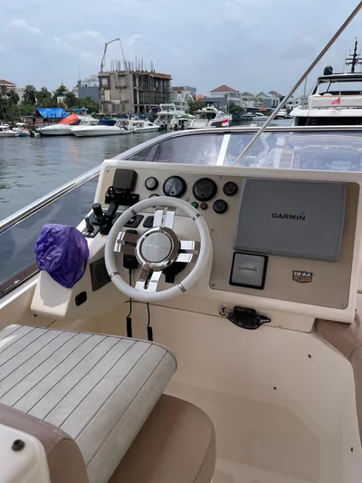 Obsession Yacht Photos Pics Cockpit of 2012 Azimut 53 yacht with Garmin navigation system, docked at marina.