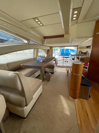 Obsession Yacht Photos Pics Luxurious interior of a 2012 Azimut 53 yacht with elegant seating and dining area.