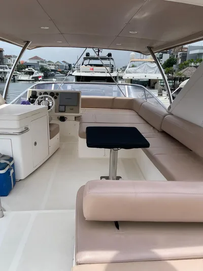 Obsession Yacht Photos Pics Luxurious 2012 Azimut 53 yacht interior with spacious seating and modern helm.