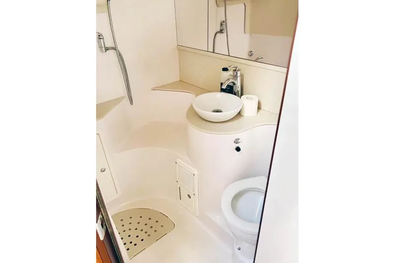 Falken Yacht Photos Pics Compact 2017 Catalina boat bathroom with shower, sink, and toilet.