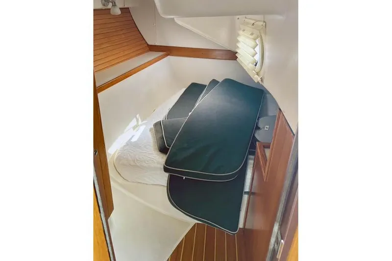 Falken Yacht Photos Pics 2017 Catalina boat interior cabin with cushions and wooden accents.