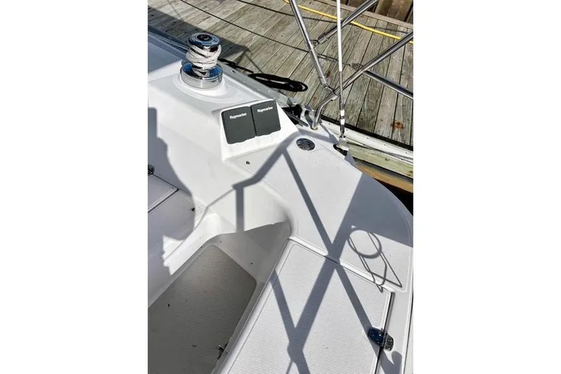 Falken Yacht Photos Pics 2017 Catalina boat deck with winch and Raymarine equipment, docked at a wooden pier.