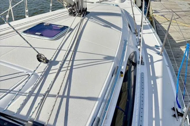 Falken Yacht Photos Pics 2017 Catalina sailboat deck with rigging, docked by the water.