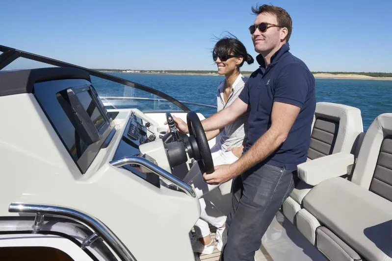 Sabinal Yacht Photos Pics Manufacturer Provided Image: Couple enjoying a ride on a 2019 Jeanneau Leader 10.5 boat.