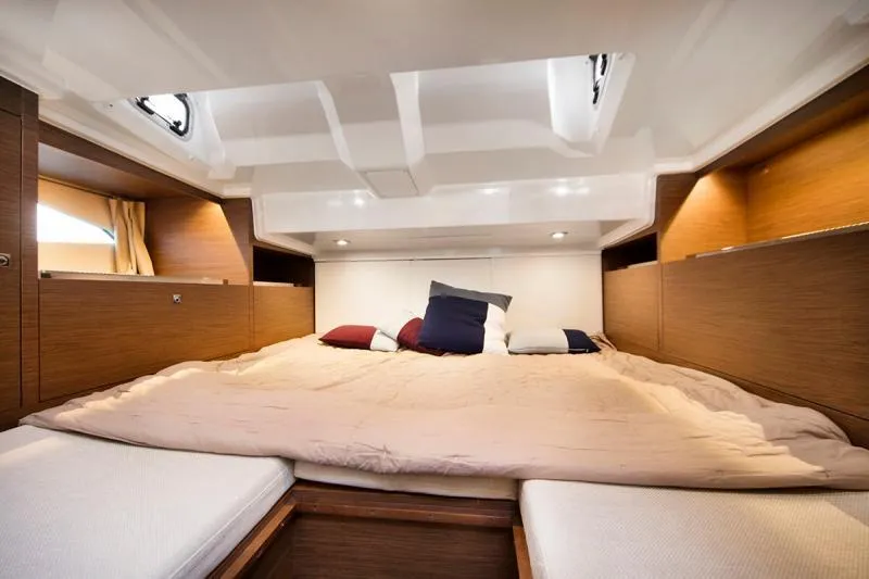 Sabinal Yacht Photos Pics Manufacturer Provided Image: Luxurious cabin interior of 2019 Jeanneau Leader 10.5 with cozy bedding and wooden accents.