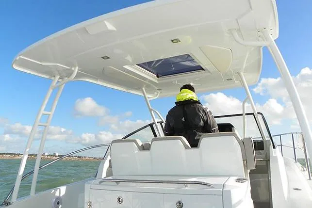 Sabinal Yacht Photos Pics Manufacturer Provided Image: 2019 Jeanneau Leader 10.5 boat with a person navigating on open water.