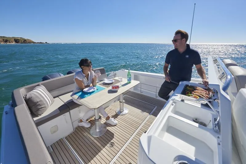 Sabinal Yacht Photos Pics Manufacturer Provided Image: 2019 Jeanneau Leader 10.5 boat with people dining on deck.