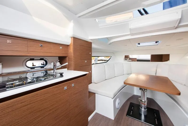 Sabinal Yacht Photos Pics Manufacturer Provided Image: Interior of 2019 Jeanneau Leader 10.5 yacht with modern kitchen and seating area.