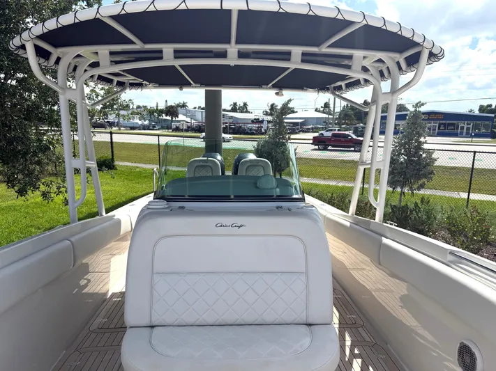 Stop Talking Yacht Photos Pics 2014 Chris-Craft Catalina 29 boat with canopy, white seating, and sleek design.