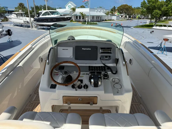 Stop Talking Yacht Photos Pics 2014 Chris-Craft Catalina 29 helm with modern controls and wooden steering wheel.