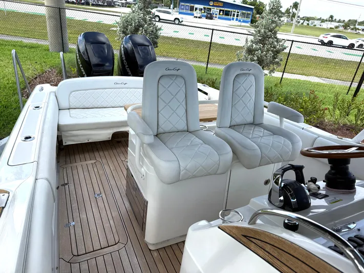 Stop Talking Yacht Photos Pics 2014 Chris-Craft Catalina 29 boat interior with luxurious seating and dual engines.