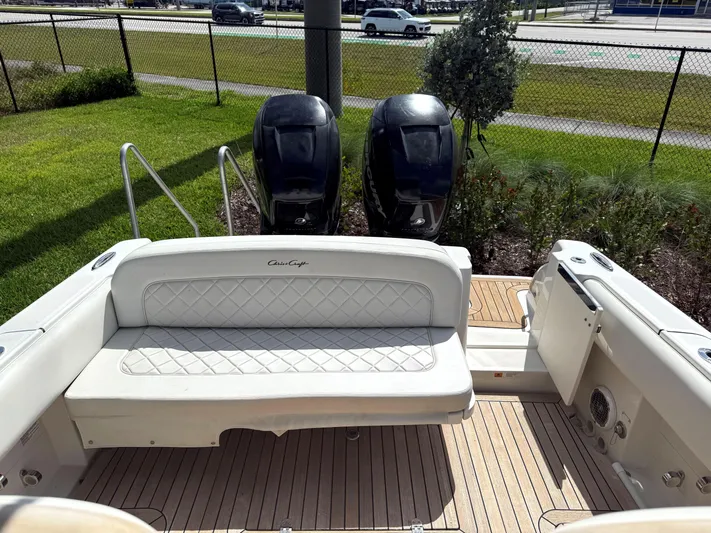 Stop Talking Yacht Photos Pics 2014 Chris-Craft Catalina 29 boat with dual outboard engines and cushioned seating.