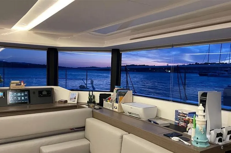  Yacht Photos Pics Interior of 2023 Leopard 53 Powercat yacht with panoramic ocean view at sunset.