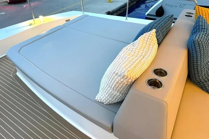  Yacht Photos Pics Luxurious seating area on 2023 Leopard 53 Powercat with cushions and cup holders.