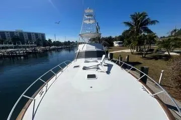 Cyclone Yacht Photos Pics 1996 Buddy Davis 67 yacht docked in sunny marina with palm trees.