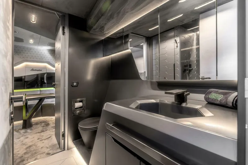 Aspen And Delilah Yacht Photos Pics Luxurious bathroom interior of 2023 Tecnomar 63 Lamborghini yacht, featuring sleek modern design.