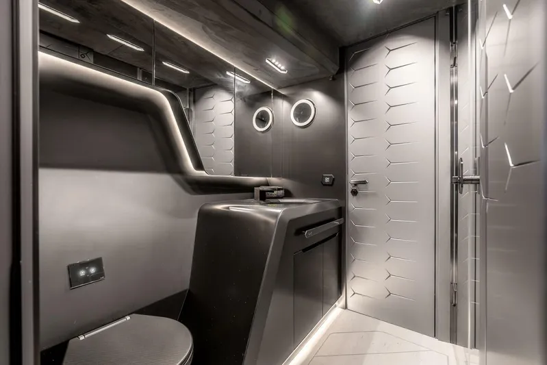 Aspen And Delilah Yacht Photos Pics Luxurious interior of 2023 Tecnomar 63 Lamborghini yacht, featuring sleek, modern bathroom design.