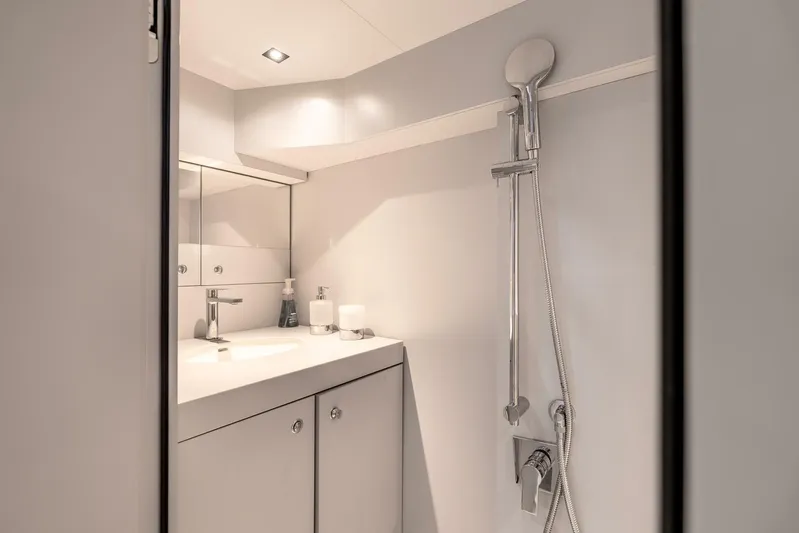 Aspen And Delilah Yacht Photos Pics Luxurious bathroom interior of 2023 Tecnomar 63 Lamborghini yacht, featuring sleek modern design.