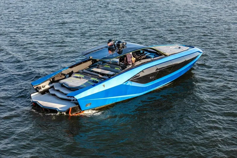 Aspen And Delilah Yacht Photos Pics Luxury Tecnomar 63 Lamborghini yacht, 2023 model, cruising on open water.
