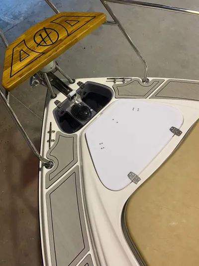  Yacht Photos Pics 2024 Hanover 305 boat deck with wooden accents and metal fittings.