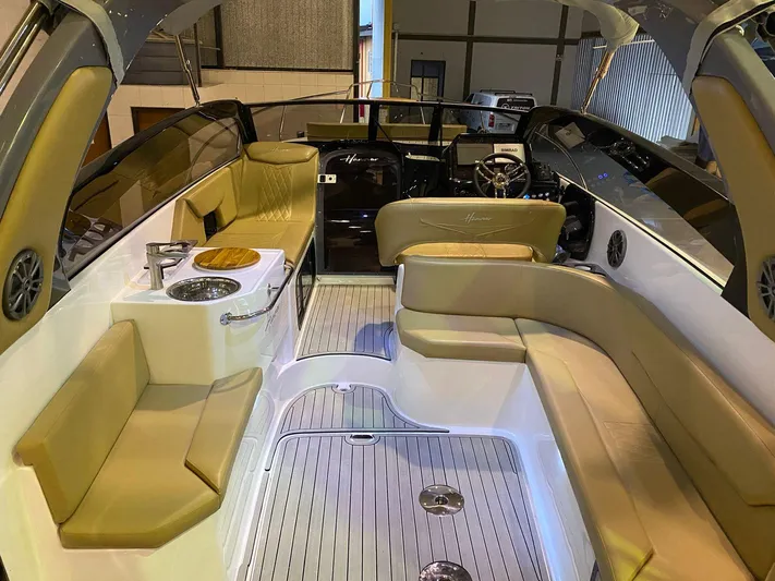  Yacht Photos Pics Luxurious interior of 2024 Hanover 305 boat with beige seating and modern amenities.