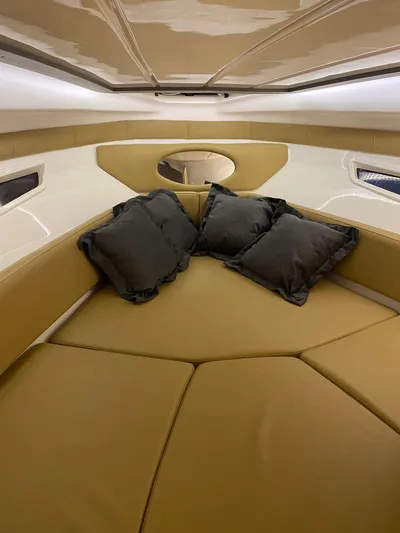  Yacht Photos Pics Luxurious interior of 2024 Hanover 305 boat with plush seating and cushions.
