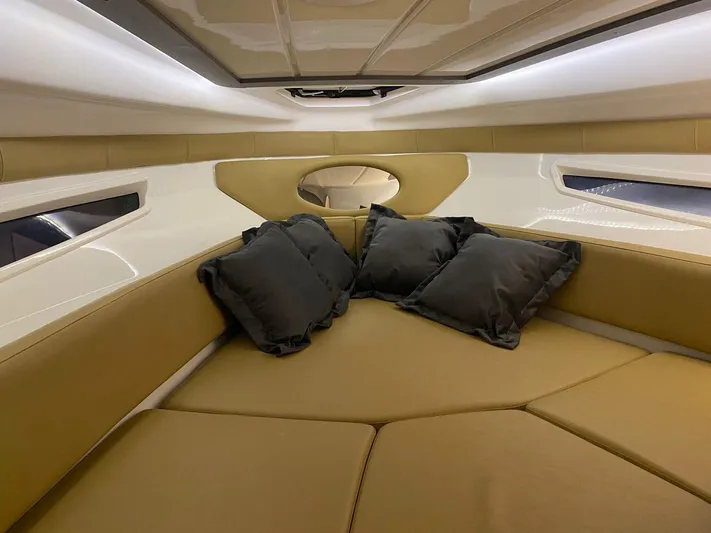  Yacht Photos Pics Luxurious interior of 2024 Hanover 305 boat with plush seating and cushions.