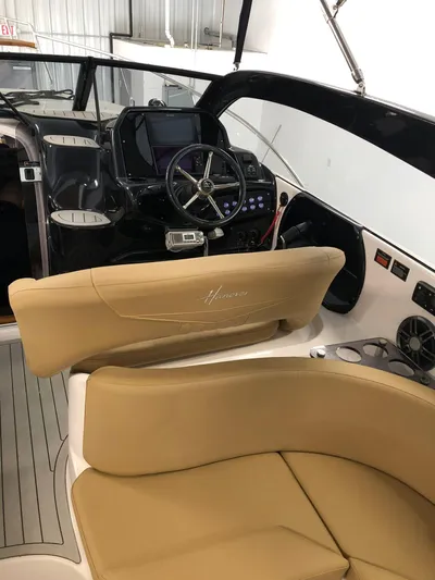  Yacht Photos Pics 2024 Hanover 305 boat interior with modern dashboard and tan seating.