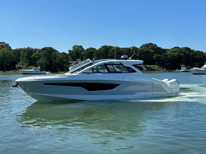  Yacht Photos Pics 2024 Cruisers Yachts 42 GLS Outboard on a serene lake.