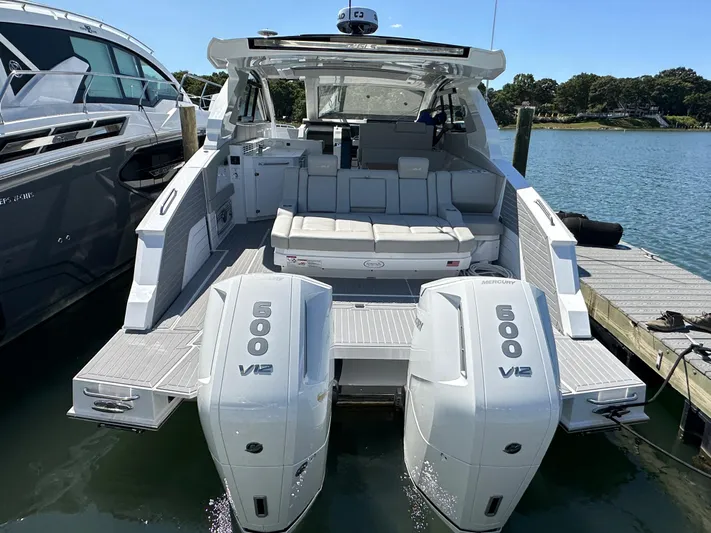  Yacht Photos Pics 2024 Cruisers Yachts 42 GLS Outboard docked, rear view with twin 600 V12 engines.