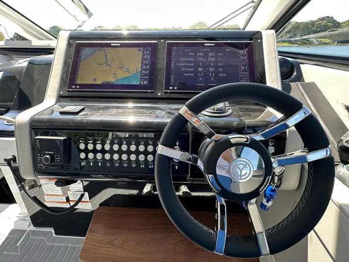  Yacht Photos Pics 2024 Cruisers Yachts 42 GLS Outboard helm with dual Simrad displays and modern steering wheel.
