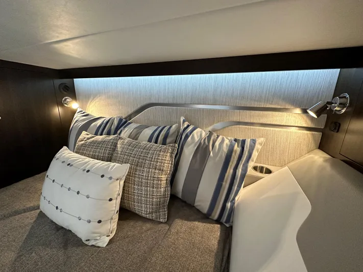  Yacht Photos Pics 2024 Cruisers Yachts 42 GLS Outboard cabin with stylish pillows and modern lighting.