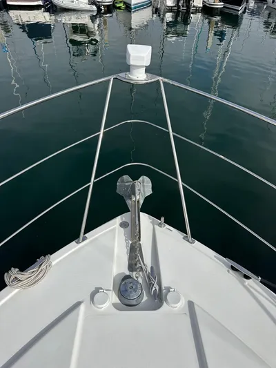 Paradigm Yacht Photos Pics Bow view of 2004 Carver 366 Motor Yacht at marina, featuring anchor and railing.