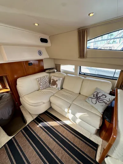 Paradigm Yacht Photos Pics Luxurious interior of 2004 Carver 366 Motor Yacht with plush seating and nautical decor.