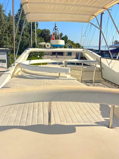  Yacht Photos Pics Flybridge of 2005 Ferretti Yachts 530, featuring spacious seating and canopy.