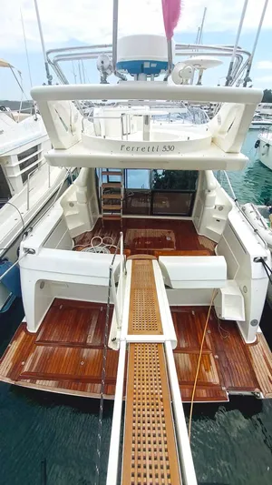  Yacht Photos Pics 2005 Ferretti Yachts 530, rear view, showcasing elegant wooden deck and spacious design.