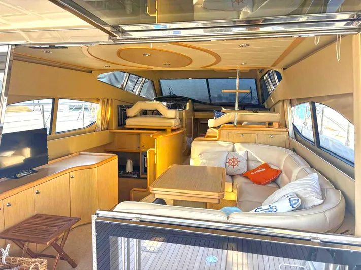  Yacht Photos Pics Luxurious interior of a 2005 Ferretti Yachts 530 with elegant seating and modern amenities.