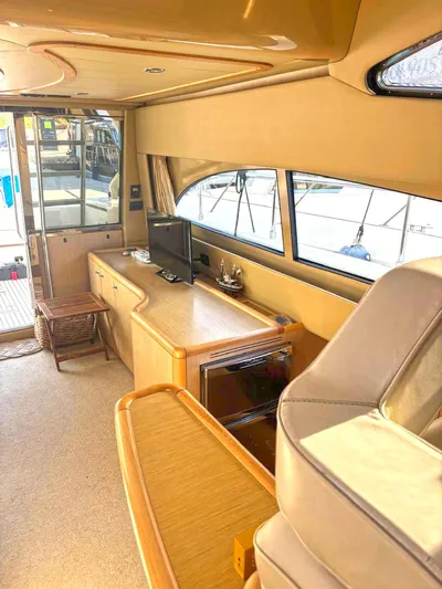  Yacht Photos Pics Luxurious interior of 2005 Ferretti Yachts 530 with elegant wood finishes and modern amenities.