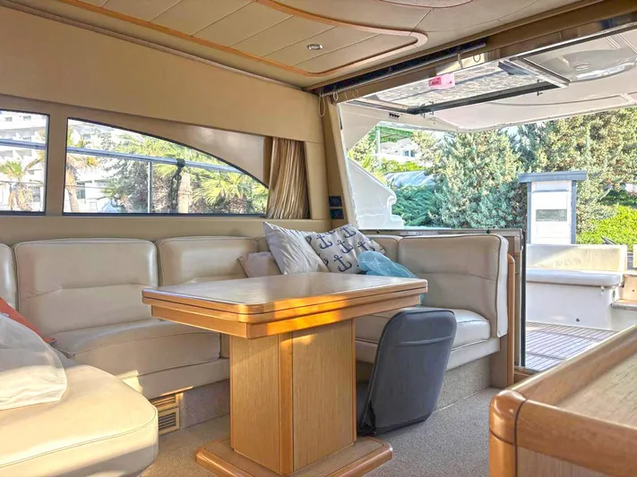 Yacht Photos Pics Luxurious interior of 2005 Ferretti Yachts 530 with elegant seating and wooden table.