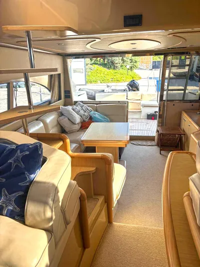  Yacht Photos Pics Luxurious interior of a 2005 Ferretti Yachts 530 with elegant seating and wooden accents.