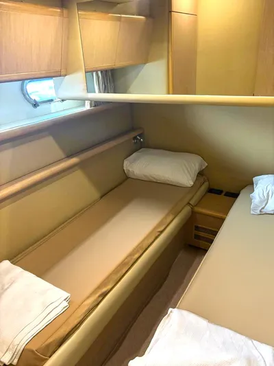  Yacht Photos Pics 2005 Ferretti Yachts 530 cabin interior with twin beds and wooden cabinetry.