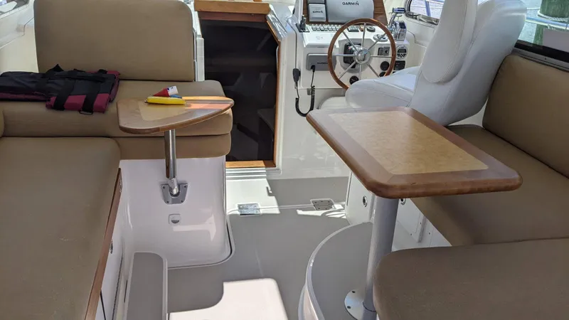  Yacht Photos Pics Interior of 2011 Back Cove 30 boat with seating and steering wheel.