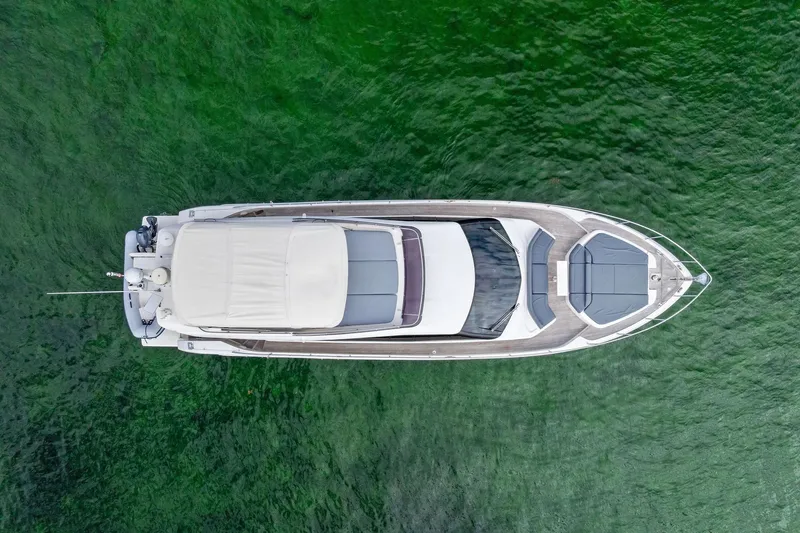 Acqua Yacht Photos Pics Aerial view of 2018 Ferretti Yachts 550 on green water.