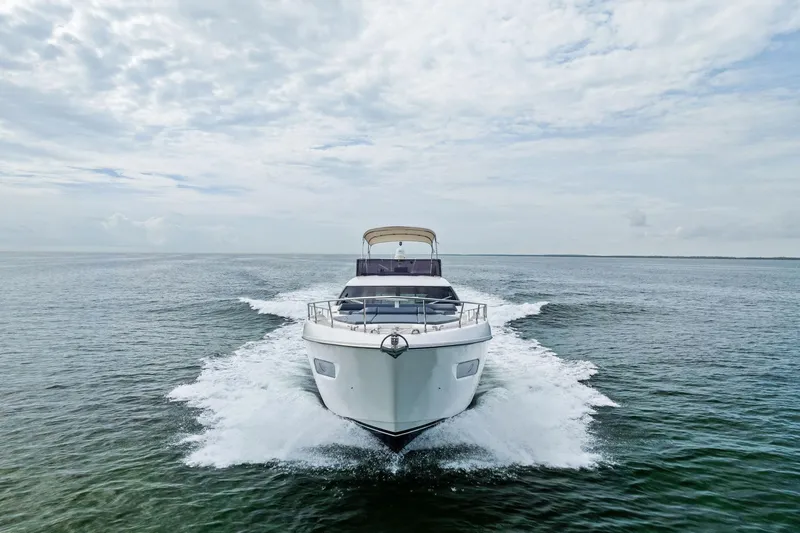 Acqua Yacht Photos Pics 2018 Ferretti Yachts 550 cruising on open water under a cloudy sky.